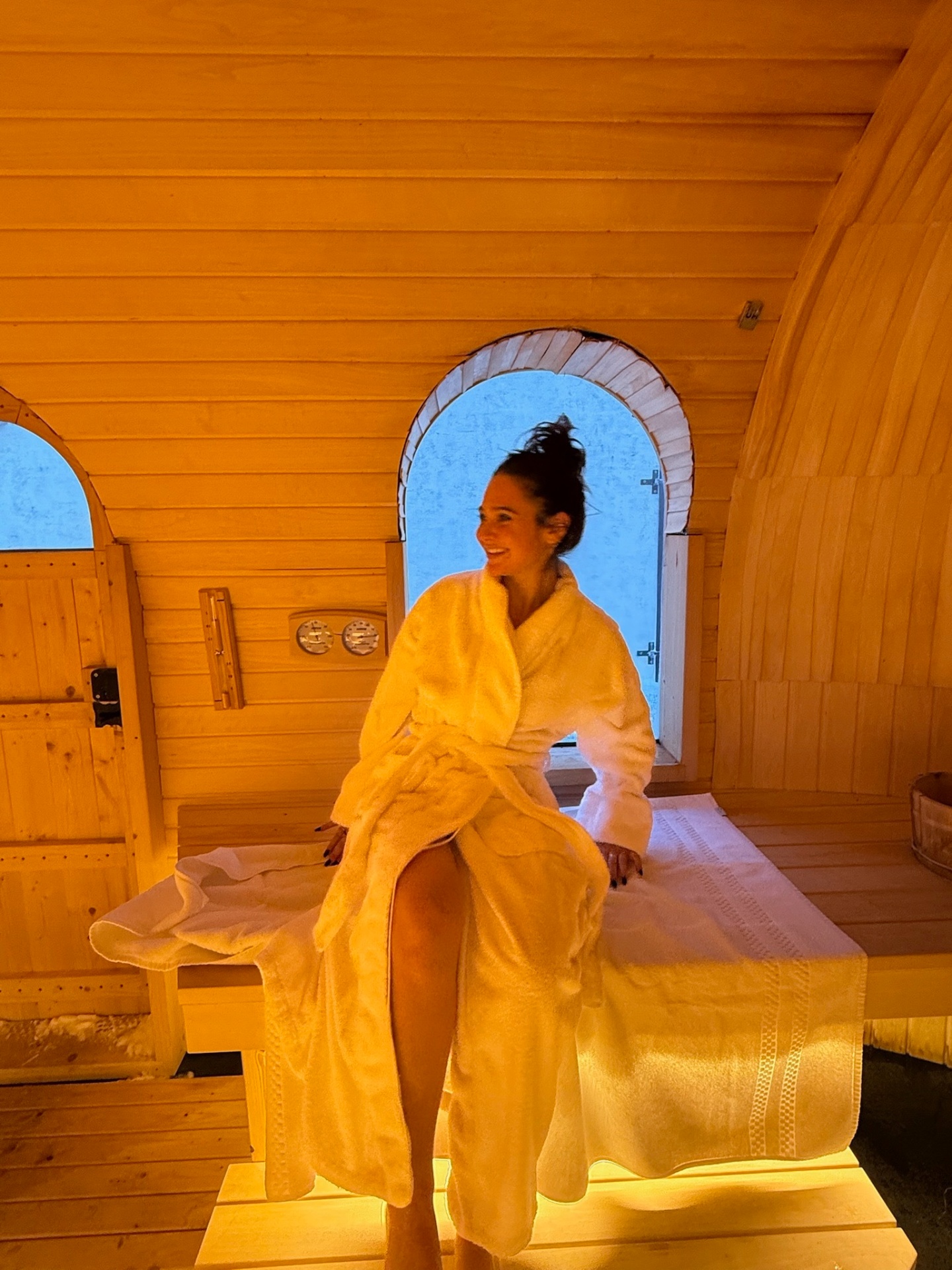 Founder of Heala in a warm sauna setting